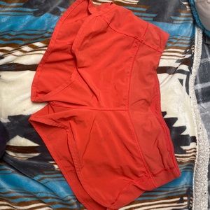 Orange Lululemon speed up shorts. I am selling because they no longer fit me!